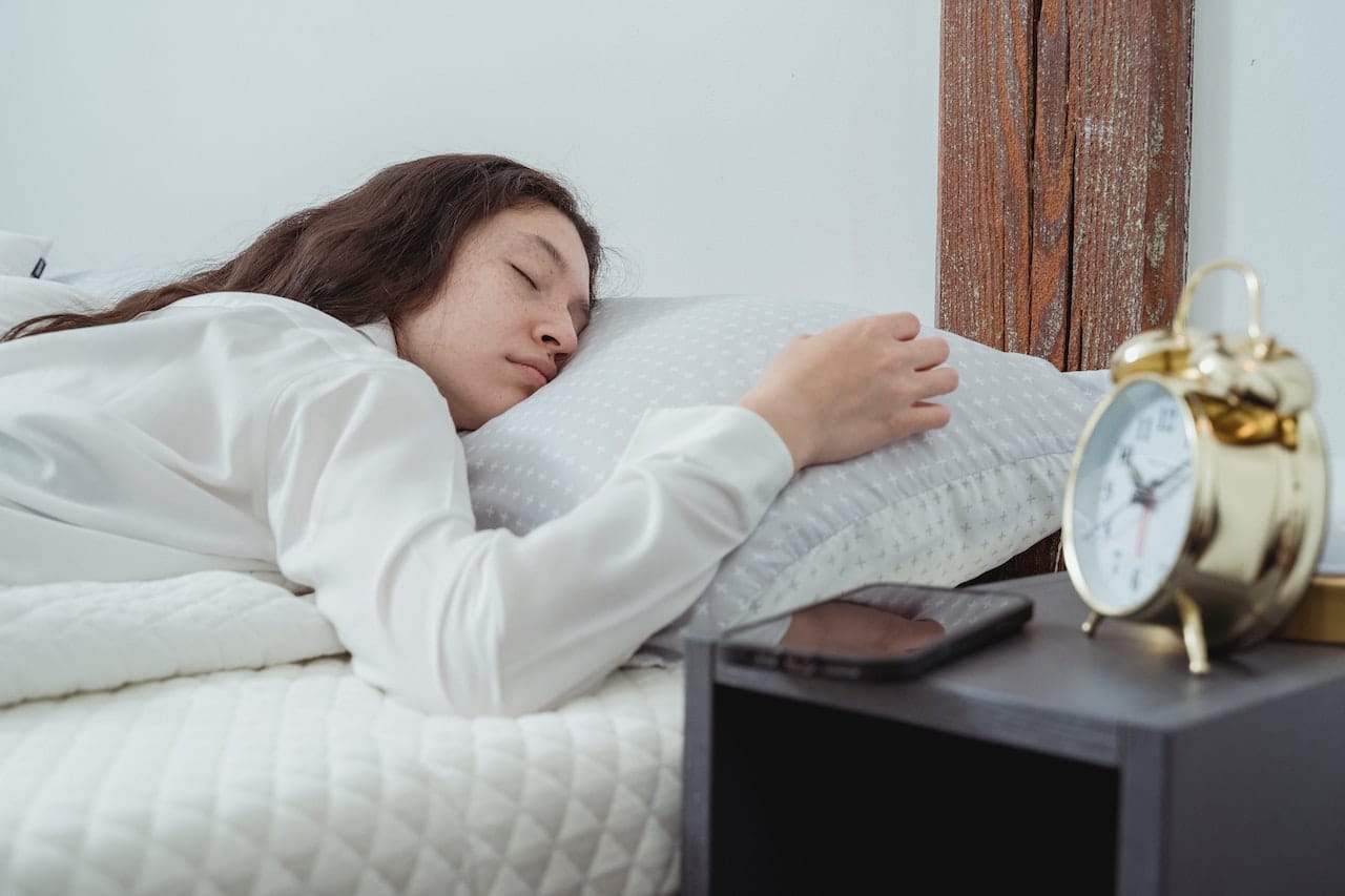 A young woman display Importance Of Sleep For Health - How long to sleep